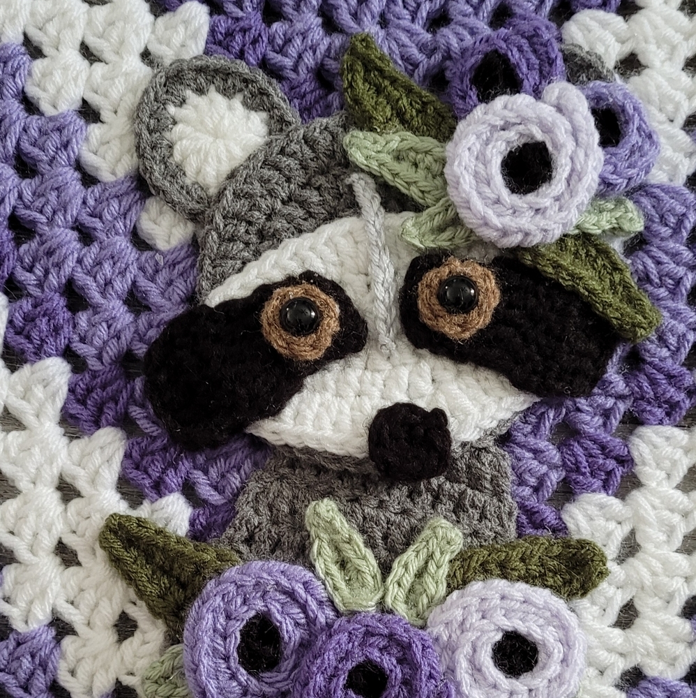 Handmade crocheted granny square boho raccoon baby blanket